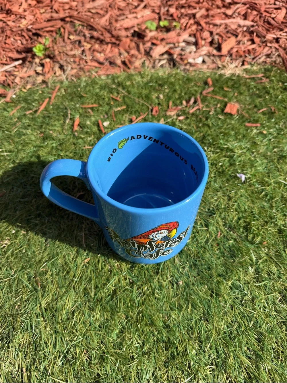 RAINFOREST CAFE Blue Mug with Parrot Graphic